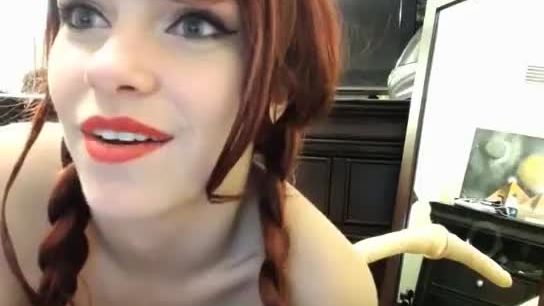 Redhead girl with hot body sucking a dildo on webcam